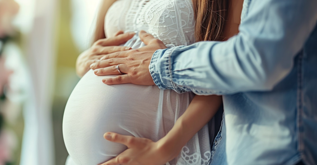 Expectant couple gently holding pregnant belly symbolizing top endometriosis pregnancy care tips