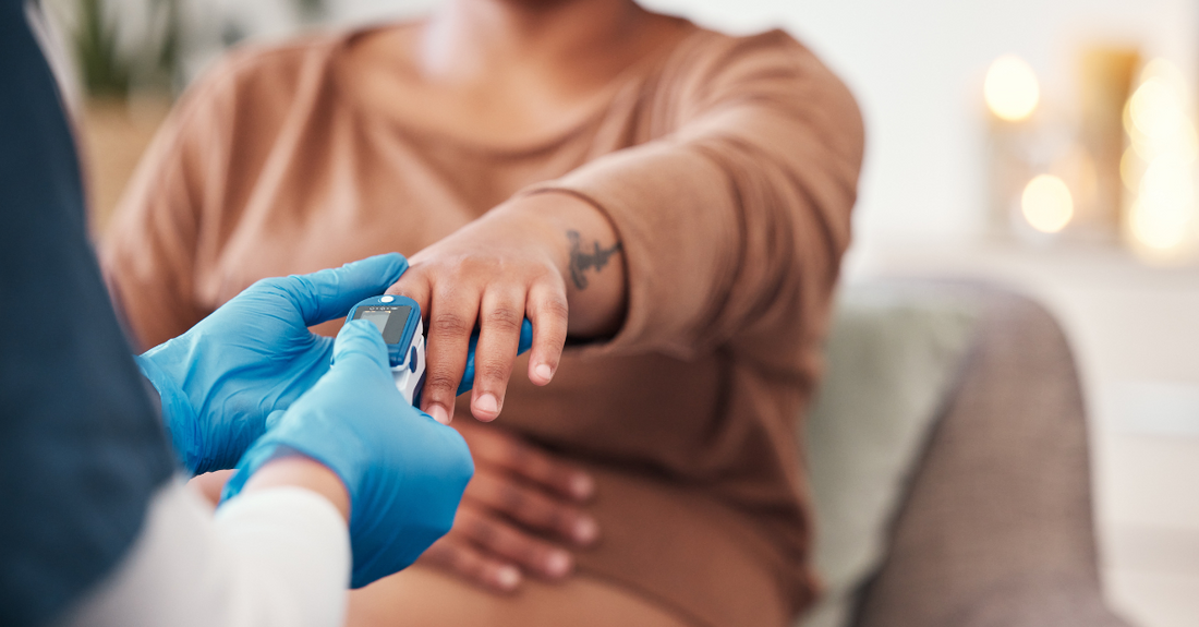 Healthcare professional checking oxygen levels for patient to conceive with endometriosis tips and care